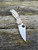 The Spyderco Para 3 Brown with blade in CPM Cruwear and handle scales in brown canvas micarta.