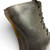 Close-up of vintage U.S. military combat boot collar showing size stamp and leather construction