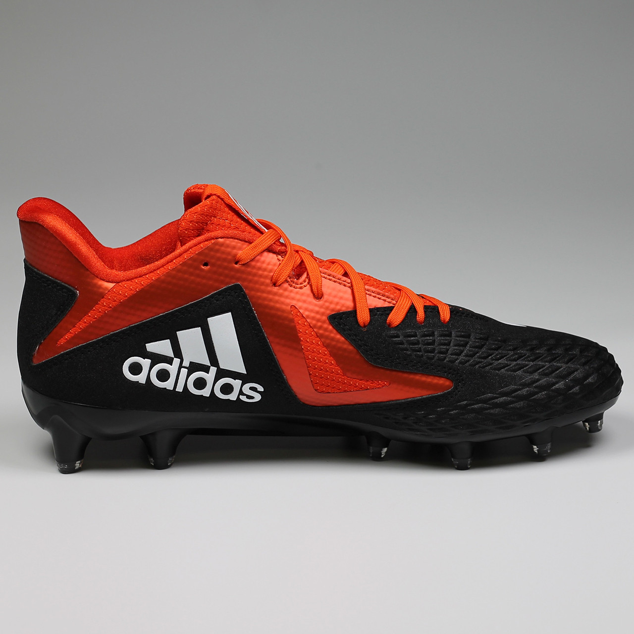 orange and black adidas cleats