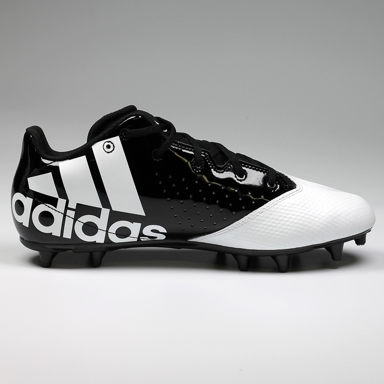 white and black football cleats