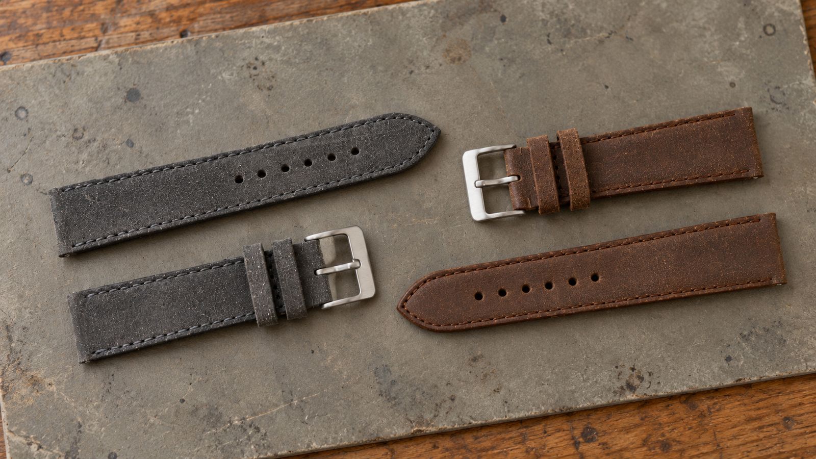 Vintage-style distressed leather watch straps in gray and brown