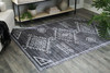 Arloman - 5' x 7' Rug - Black / Cream / Gray