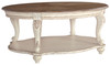 Realyn - White / Brown - Oval Cocktail Table