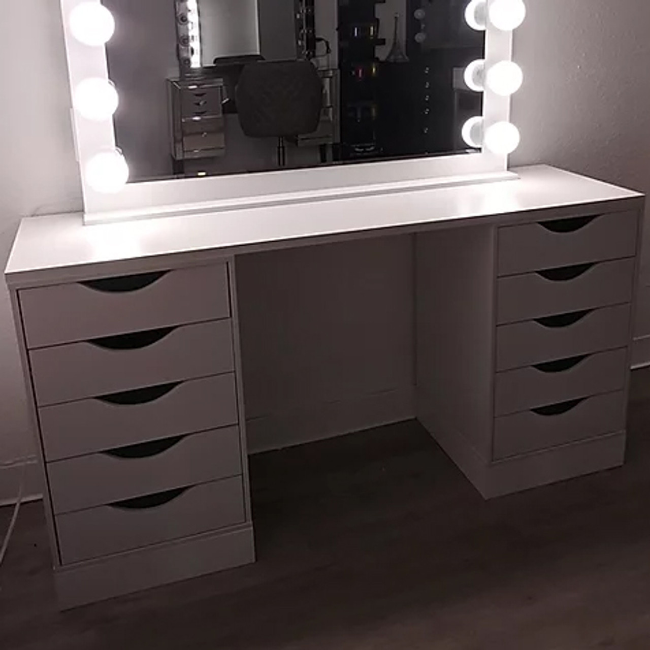 white vanity table with lights