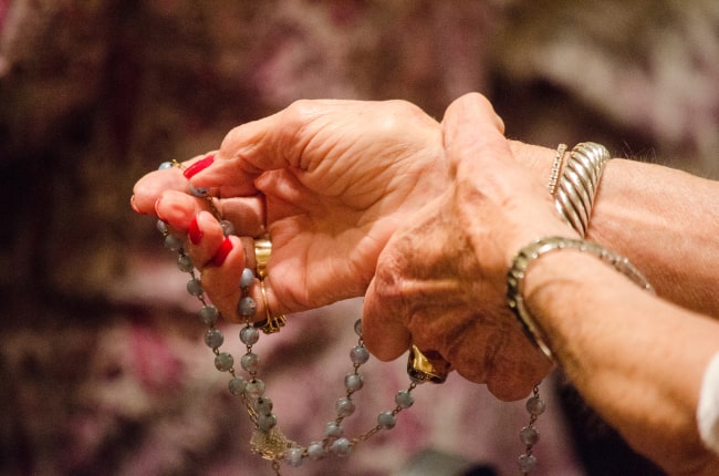 Praying the Holy Rosary.