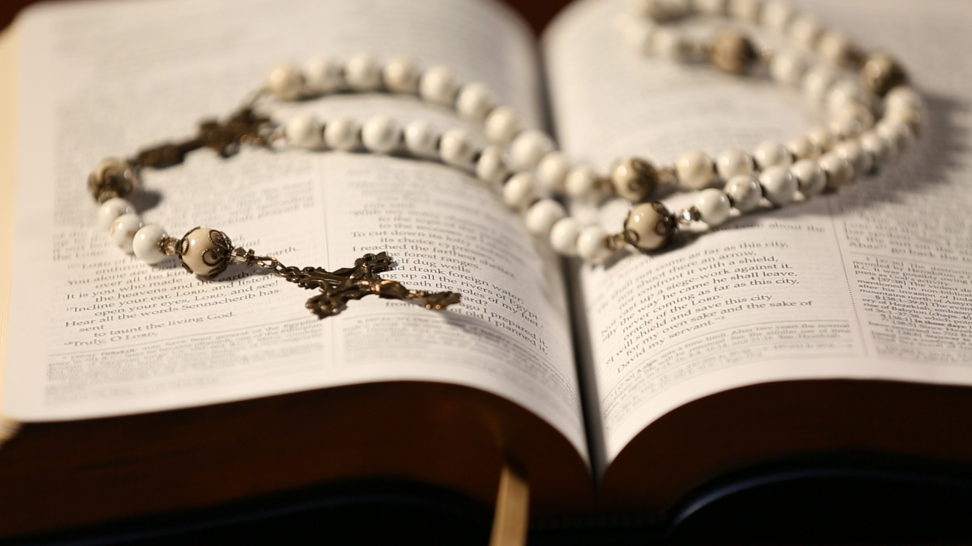 Rosary beads on a bible