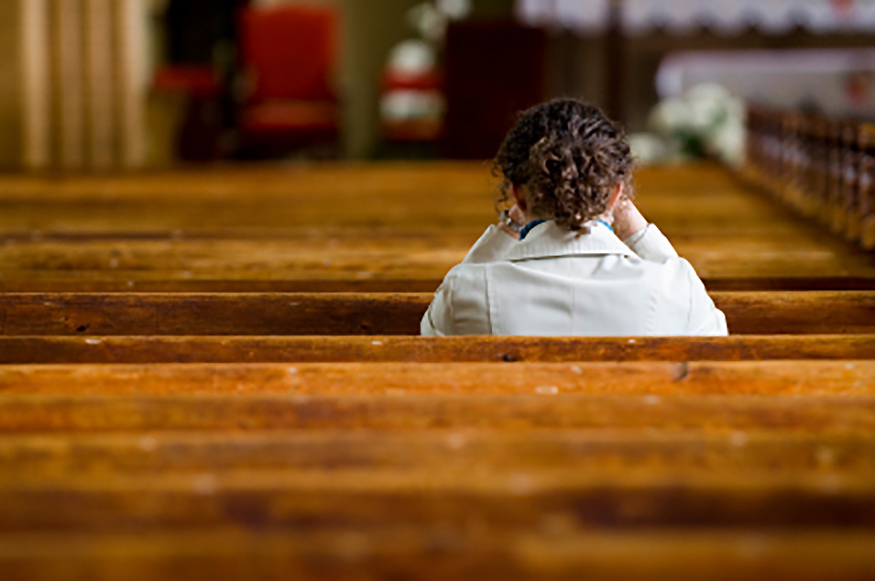 woman alone in church