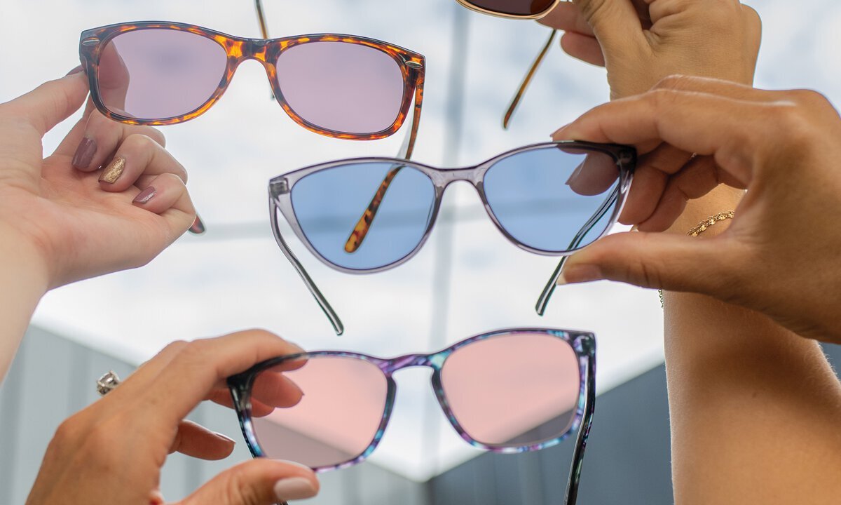 Get help choosing your TheraSpecs lens Various people holding different TheraSpecs glasses
