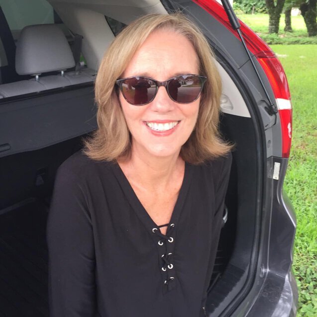 JoAnn wearing FL-Sun TheraSpecs for sunlight sensitivity