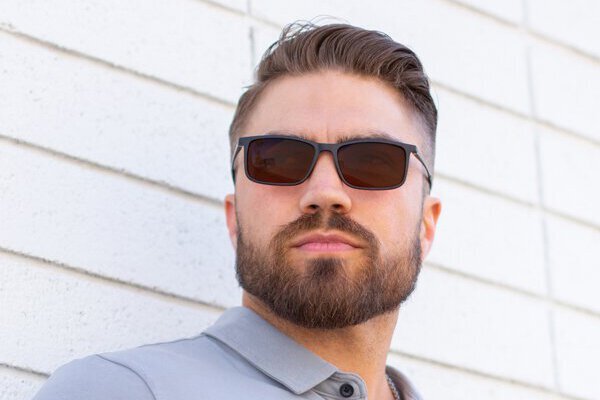 Man wearing FL-Sun Sunglasses by TheraSpecs Man wearing FL-Sun Sunglasses by TheraSpecs