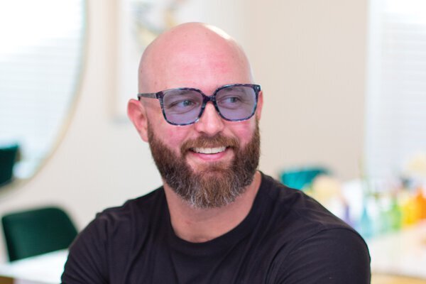 Man wearing Z-Blue Glasses by TheraSpecs Man wearing Z-Blue Glasses by TheraSpecs