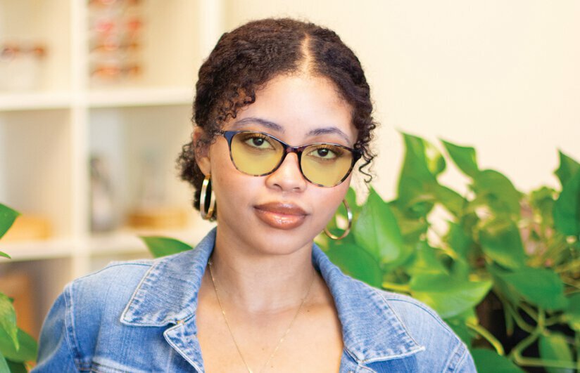 Young woman wearing TheraSpecs Contrast HEV lens