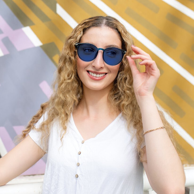 TheraSpecs Z-Blue glasses for Photosensitivity and Flashing Lights Woman Wearing TheraSpecs Z-Blue Glasses in Max Strength