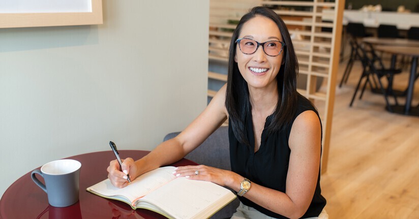 Woman wearing TheraSpecs glasses as a photophobia home remedy