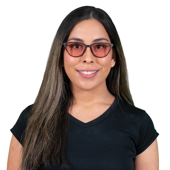 Woman wearing Betty TheraSpecs in Brown with indoor lenses