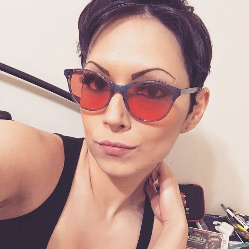 Jess wearing indoor TheraSpecs in the Audrey blue frame Man wearing indoor TheraSpecs