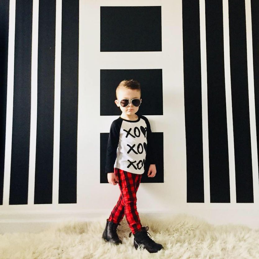 McLean wearing aviator sunglasses inside McLean Sinclair wearing aviator sunglasses inside