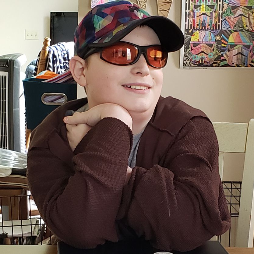 Michael wearing indoor wrap TheraSpecs Michael wearing indoor Wrap TheraSpecs, smiling