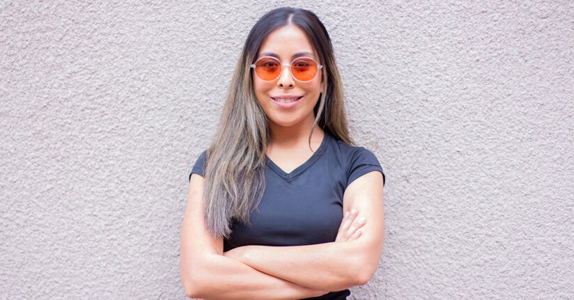 FL-Pro TheraSpecs glasses for blue light-related migraine and headache symptoms Woman wearing FL-Pro TheraSpecs for blue light headaches and migraines