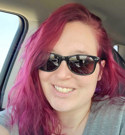 Tori wearing outdoor Classic TheraSpecs for migraine