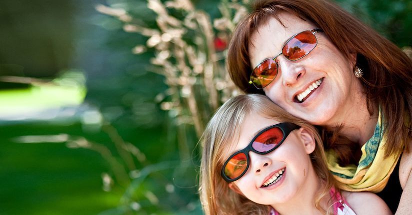 Mom and daughter wearing TheraSpecs for light sensitivity relief