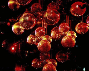 Disco Mirror Ball hanging from the ceiling night club 