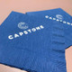 Your Logo Napkins Example: Silver Foil-Pressed on Blue Napkins Your Logo Napkins Example: Silver Foil-Pressed on Blue Napkins