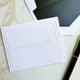 Your Logo Embossed 4x5 Fold Notes with Embassy Border Example - White Paper with Black Envelope Liners - StationeryXpress.com