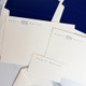 150 Piece Olympic Stationery Set Close Up - 3 Flat Card Sizes - StationeryXpress.com (EG1095)
(Shown with Ivory Paper, Navy Raised Ink, and Optional Navy Envelope Liners)