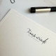 Your Logo Printed on Flat Cards - 4.5” x 6.25” - Close Up of Tradition Border, Ivory Paper, with Black Raised Ink - StationeryXpress.com