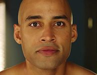 Round face shape with soft contours, suited for styles that add definition along the cheekbones