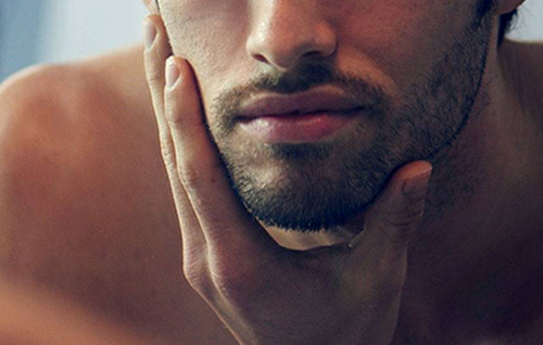Neatly trimmed beard along the jawline as part of a beard grooming routine