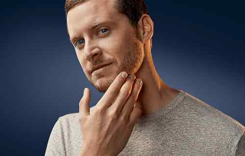 Well‑groomed short boxed beard showing clean lines and even beard length