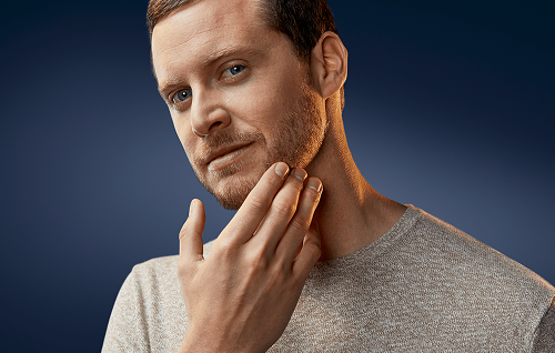 Well‑groomed short boxed beard showing clean lines and even beard length