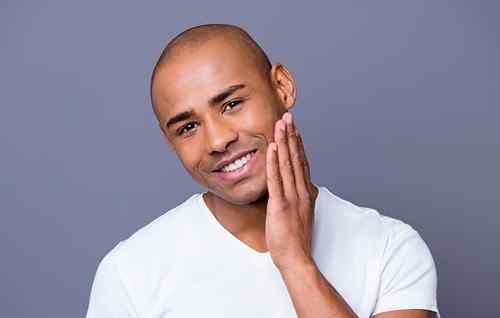 Checking skin closely to assess razor blade sharpness and shaving results