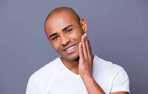 Checking skin closely to assess razor blade sharpness and shaving results