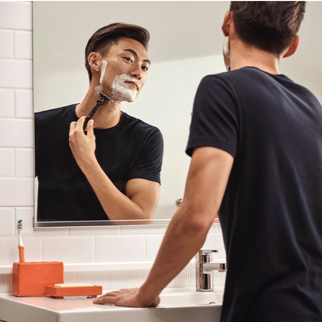 Man shaving at home image