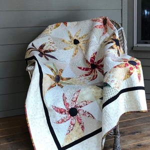 Black Eyed Susan quilt finished with scrappy fabrics