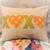 Decor pillow with hearts appliqued