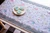Table runner in pale blues made with the broadway border printed interfacing pattern
