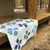 blue bear paw quilt on a porch