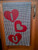 Hearts with letters inside on a valentine banner