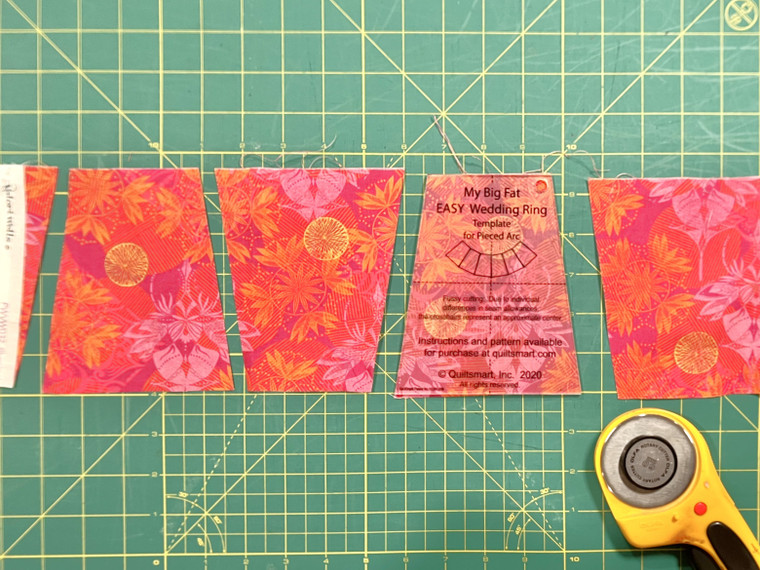 The My Big Fat Wedding Ring Template shown cutting fabric wedges with a rotary cutter