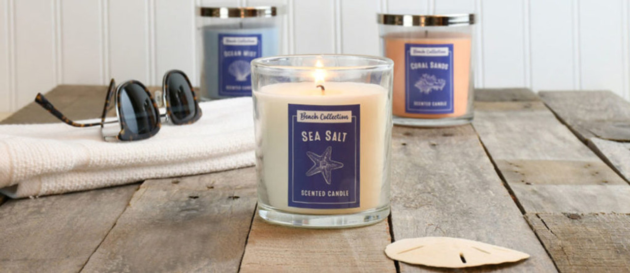 Beach scented candles light up the table in your beach house or home.