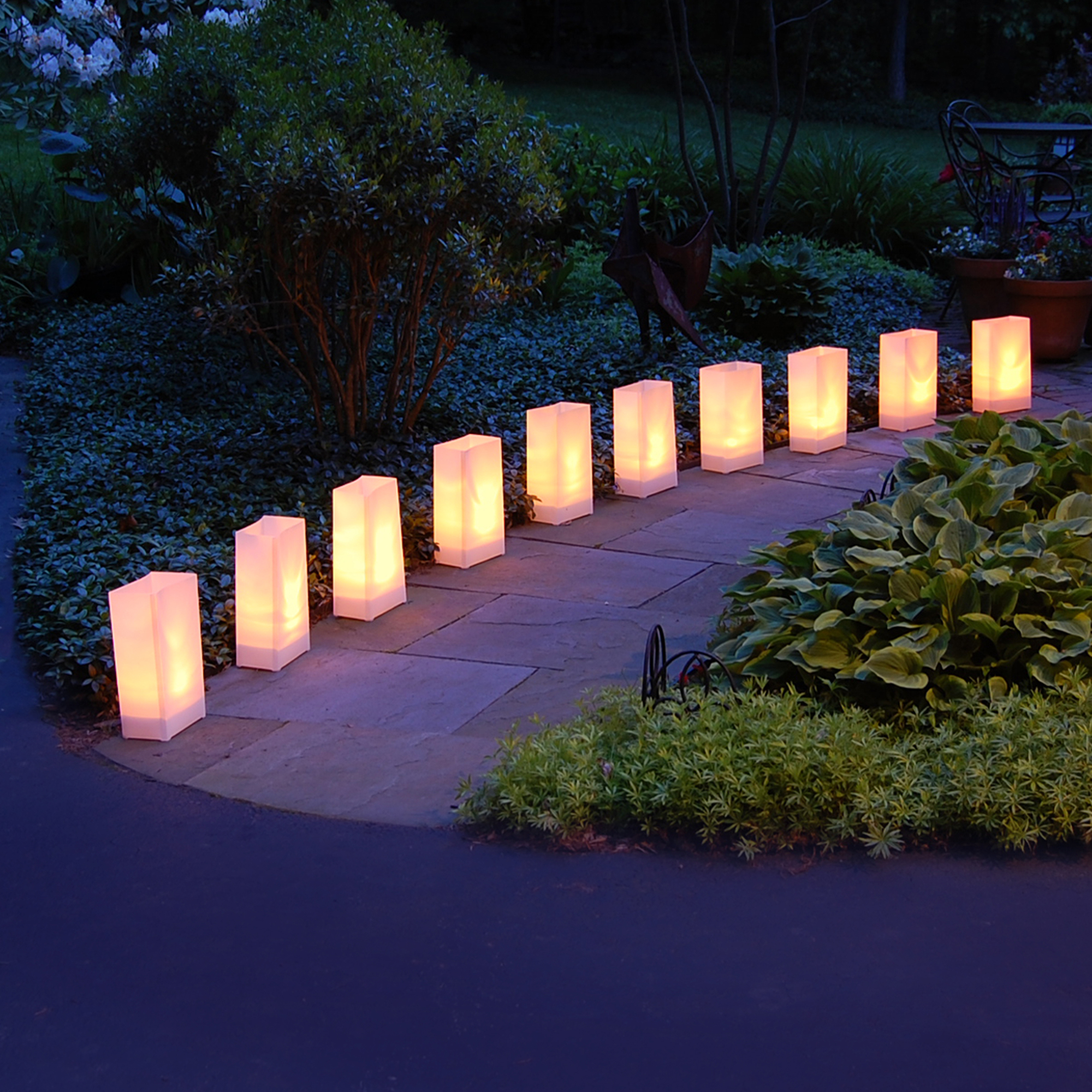 Luminaria bags line the walkway and light the path at night.