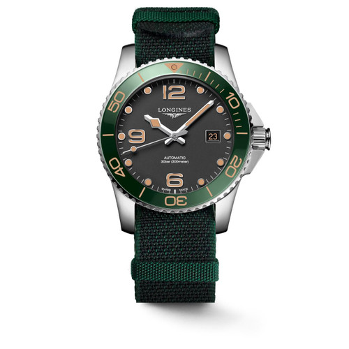 LONGINES HYDROCONQUEST [L3.781.4.05.2], men's professional diver's watch with black dial, luminous hands and markers, green unidirectional rotating bezel, date display, automatic movement, water-resistant up to 300 meters, and a green and black fabric strap.