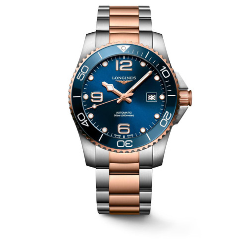 Longines HydroConquest, luxury men's diver watch with blue dial, stainless steel and rose gold bracelet, rotating bezel, date display, and Swiss automatic movement.