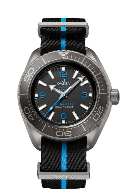 OMEGA Seamaster Planet Ocean 6000M co-axial Master Chronometer 45.5 mm watch, stainless steel case with black dial, blue accents, and a black fabric strap with blue stripe.