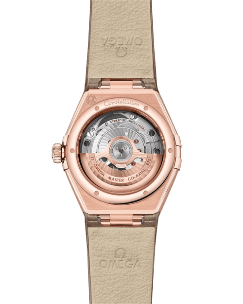 OMEGA Constellation co-axial Master Chronometer 29 mm watch, view of the back showcasing the movement through a transparent case back with rose gold case and beige leather strap.