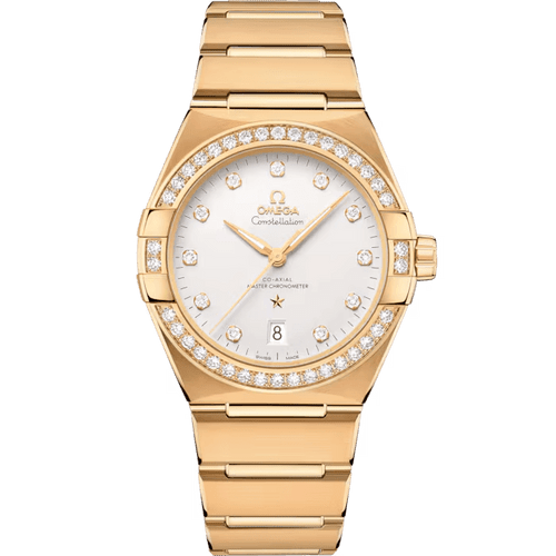 OMEGA Constellation co-axial Master Chronometer 39 mm [13155392052002] - Elegant gold watch with diamond bezel, white dial, day and date display, and stainless steel bracelet.